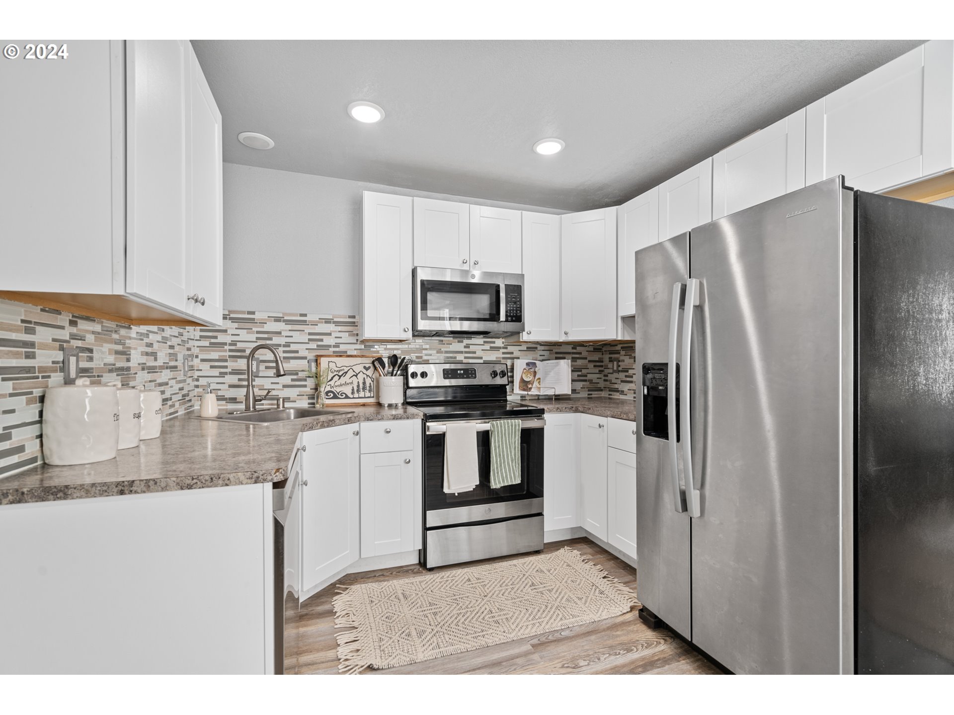 805 Southwest 28th Street Pendleton, OR 97801 - Photo 10 of 25 a kitchen with a refrigerator sink and microwave