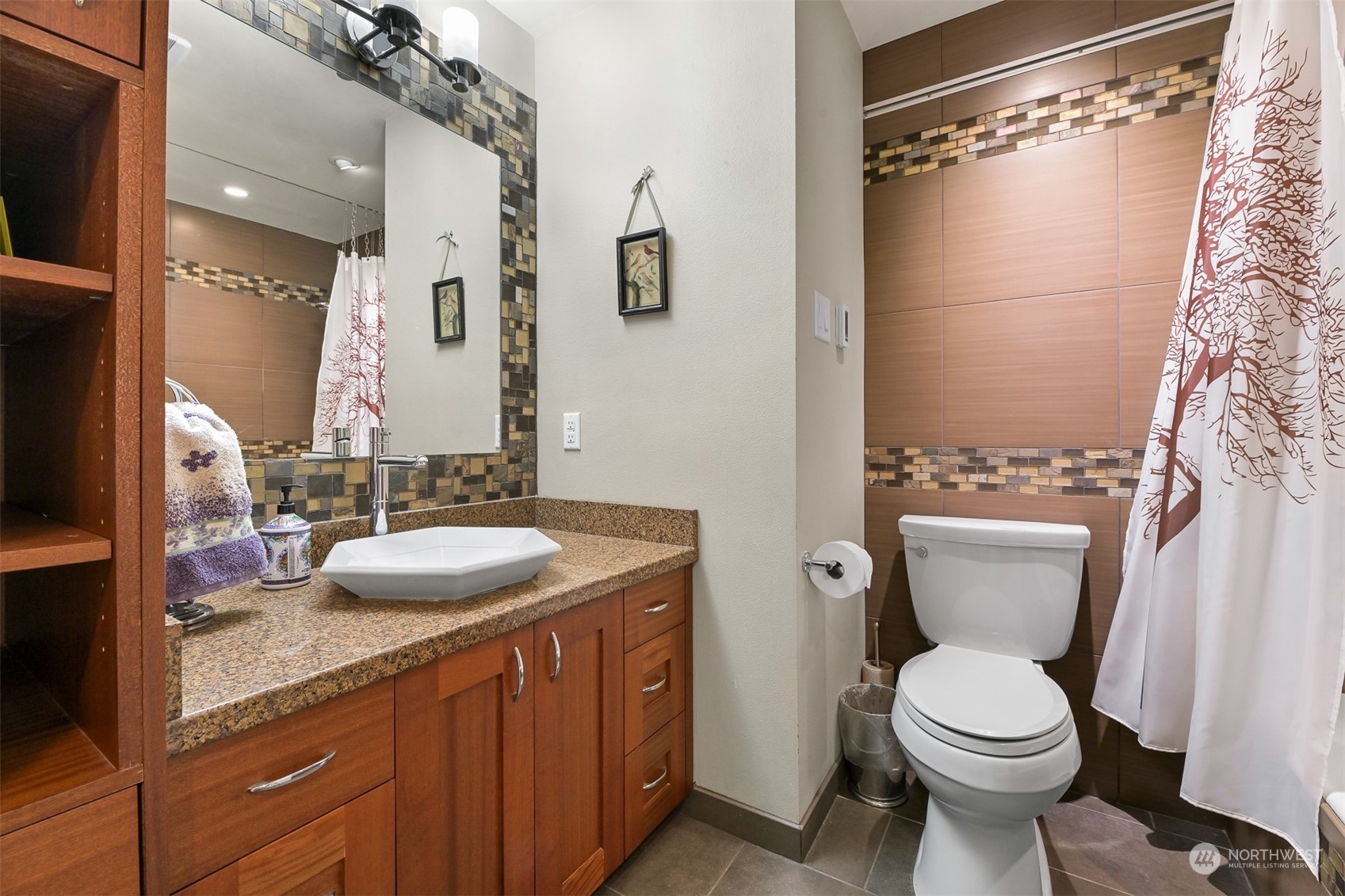 414 Fieldston Road Bellingham, WA 98225 - Photo 17 of 27 a bathroom with a granite countertop sink toilet and shower