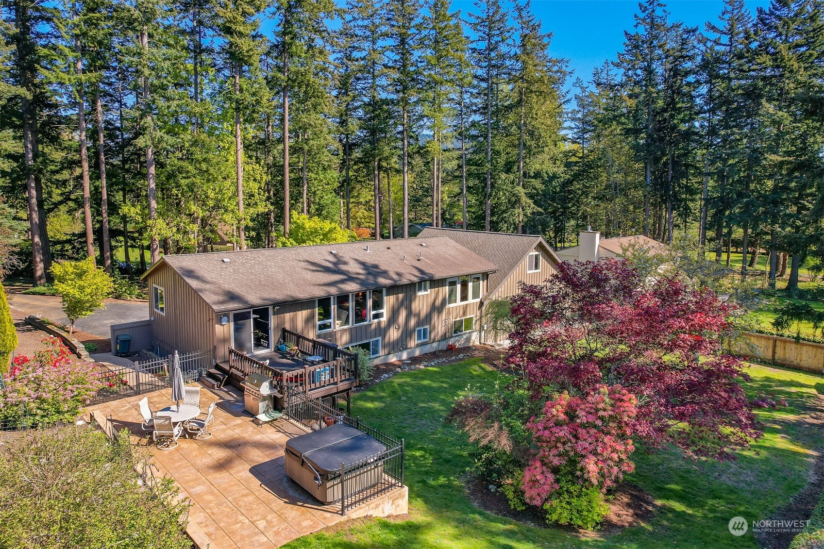 414 Fieldston Road Bellingham, WA 98225 - Photo 25 of 27 a view of a patio with table and chairs and potted plants