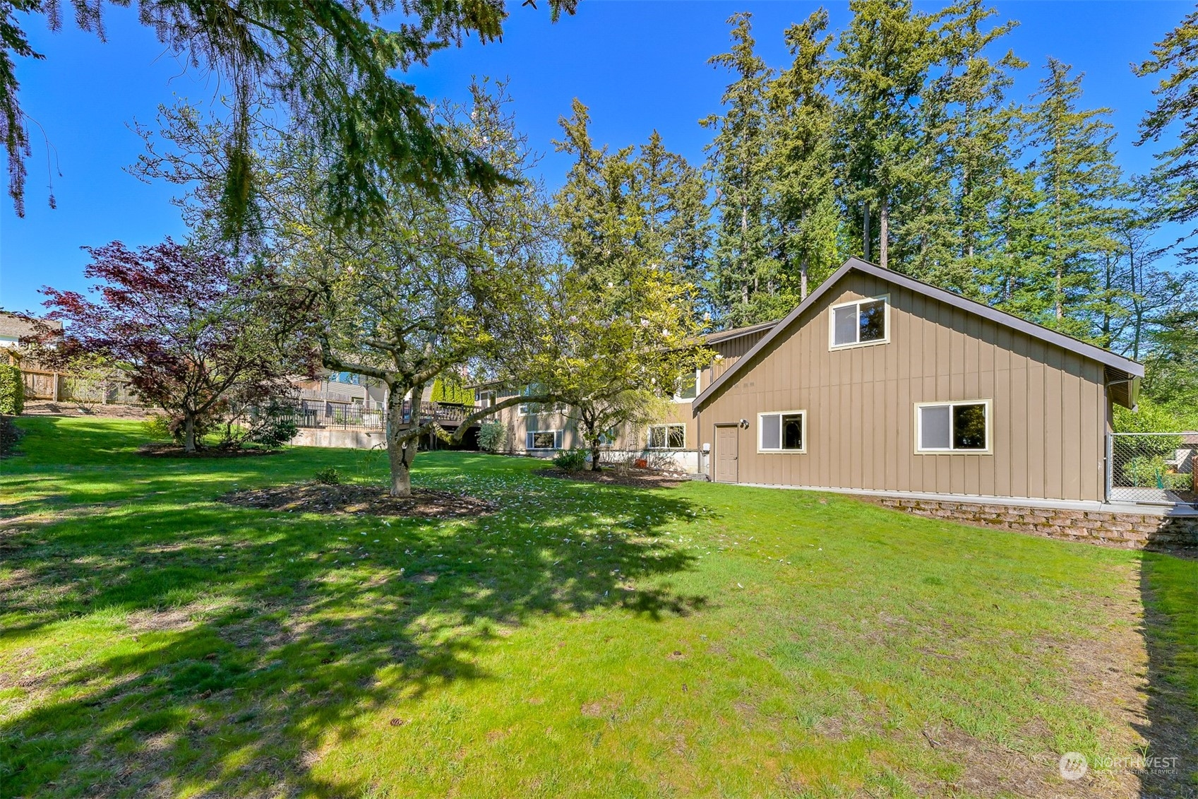 414 Fieldston Road Bellingham, WA 98225 - Photo 26 of 27 a view of a backyard with large trees