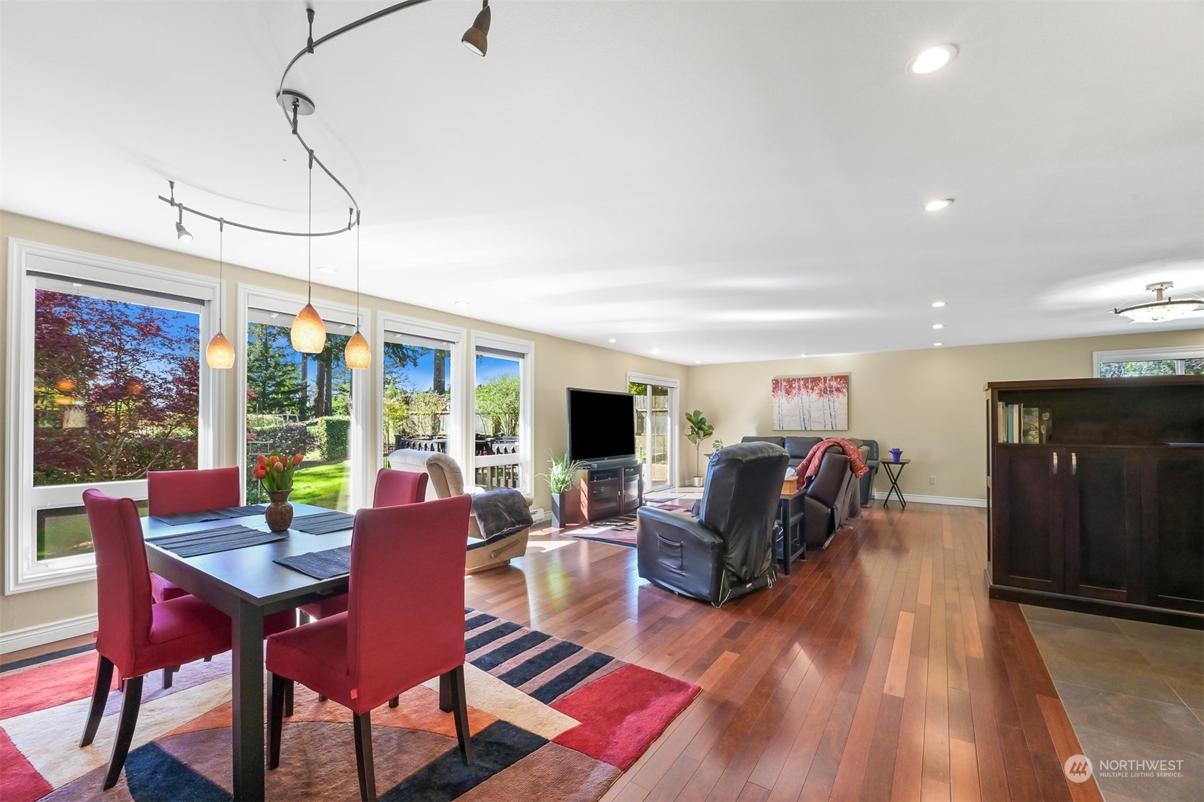 414 Fieldston Road Bellingham, WA 98225 - Photo 5 of 27 a living room with furniture a flat screen tv and a table