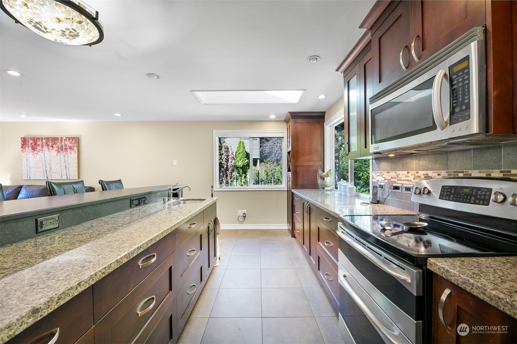 414 Fieldston Road Bellingham, WA 98225 - Photo 7 of 27 a large kitchen with stainless steel appliances granite countertop a lot of counter space and a large window