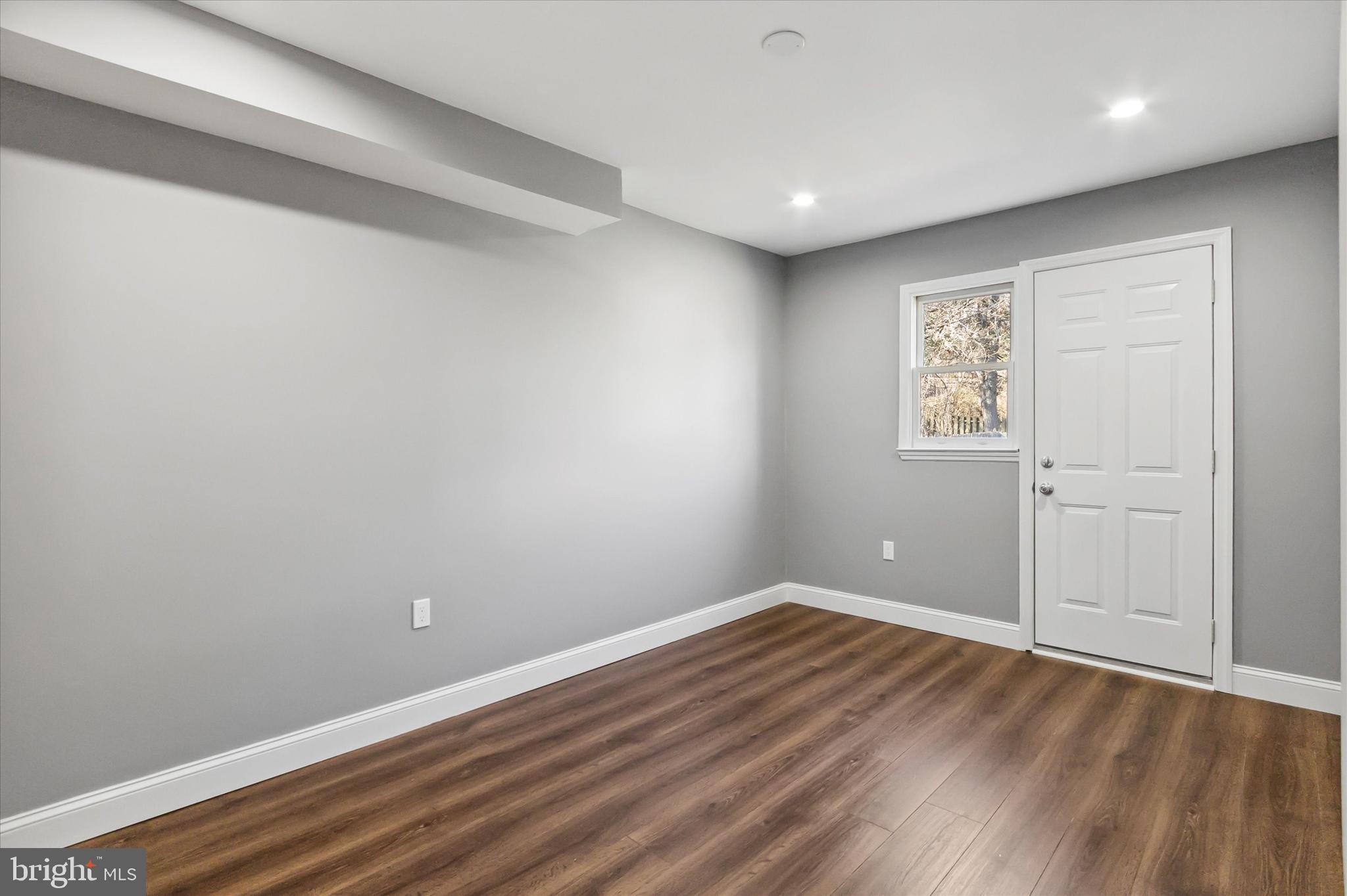 296 Greenough Street, Unit 2 Philadelphia, PA 19127 - Photo 15 of 24 a view of room with window and hardwood floor