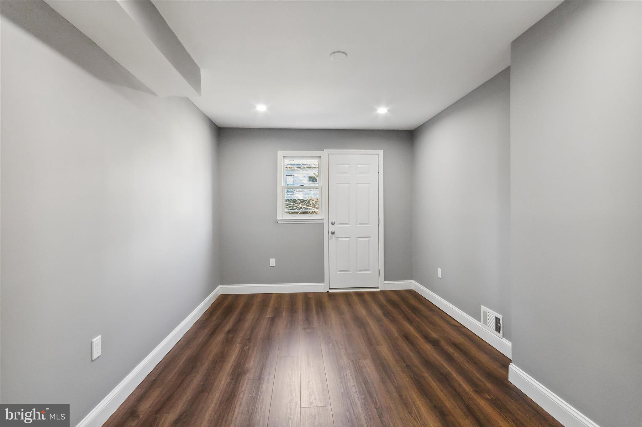 296 Greenough Street, Unit 2 Philadelphia, PA 19127 - Photo 18 of 24 a view of room with window wooden floor and windows