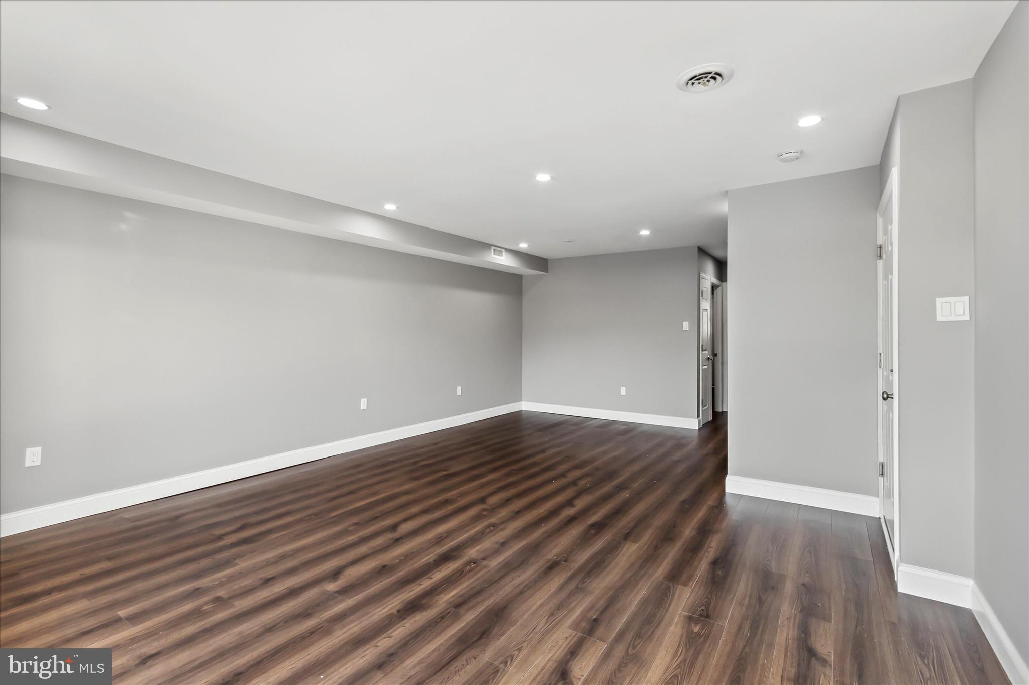 296 Greenough Street, Unit 2 Philadelphia, PA 19127 - Photo 2 of 24 a view of an empty room with wooden floor