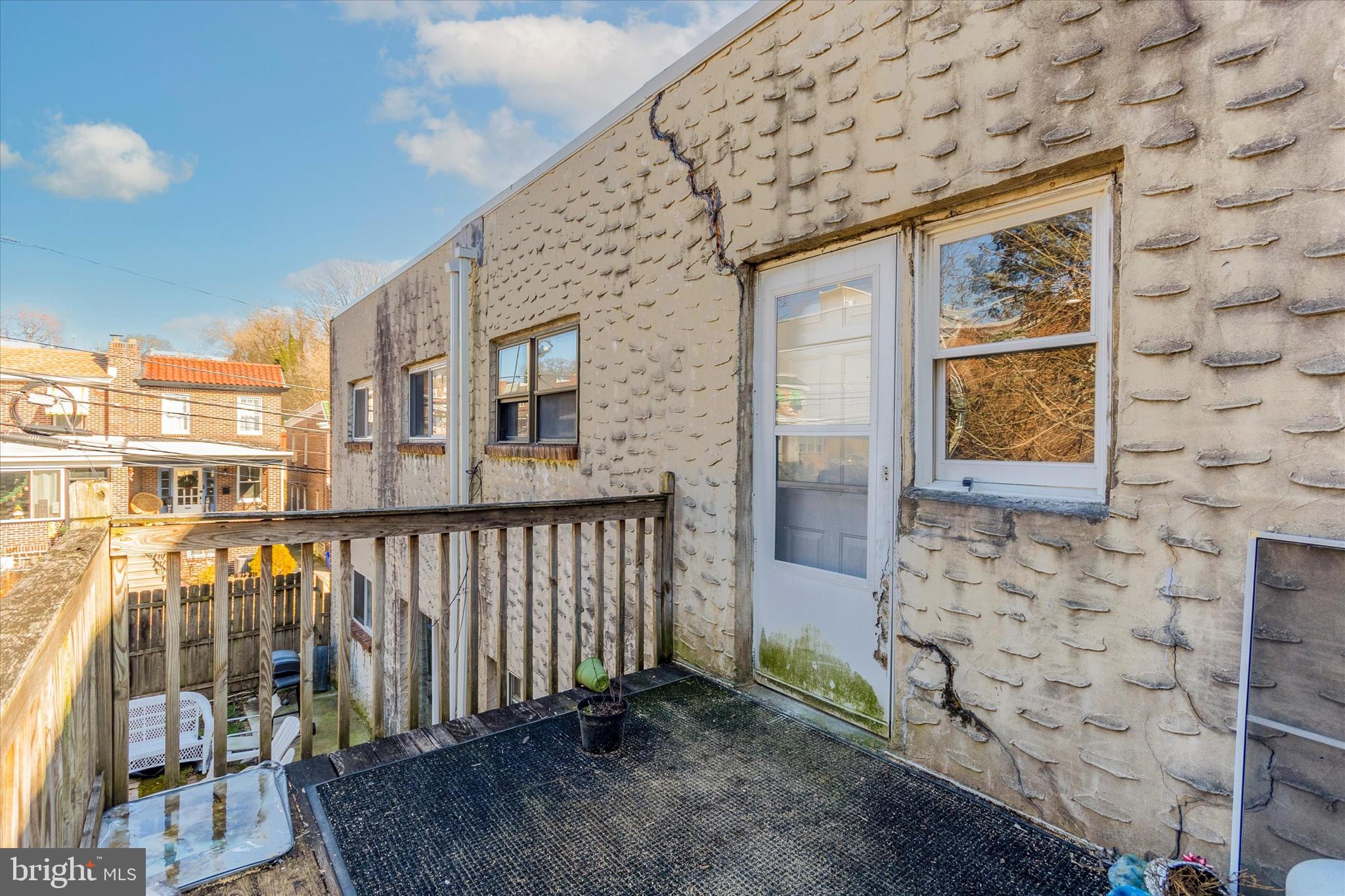 296 Greenough Street, Unit 2 Philadelphia, PA 19127 - Photo 23 of 24 a view of a brick house with a porch
