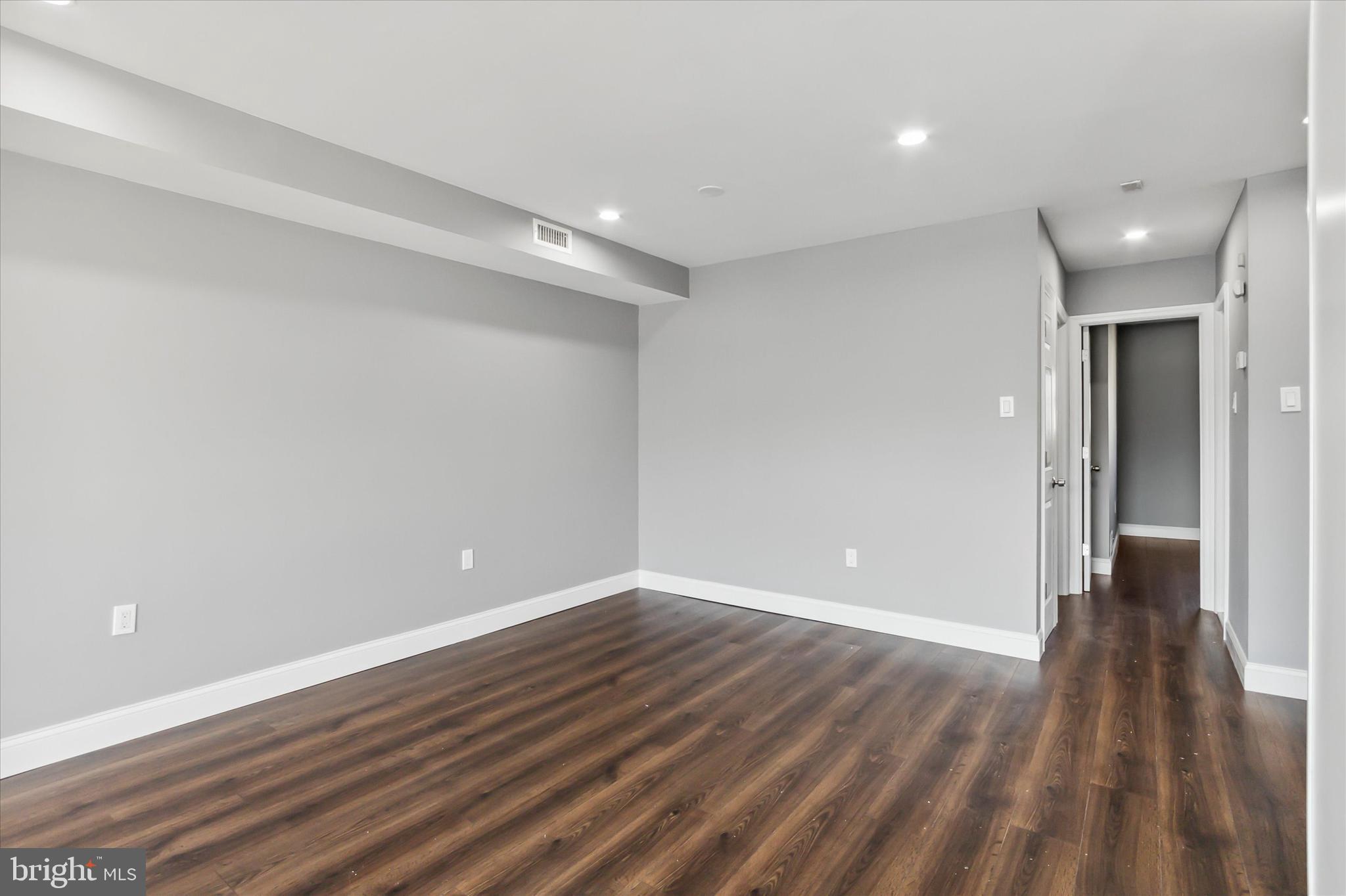 296 Greenough Street, Unit 2 Philadelphia, PA 19127 - Photo 6 of 24 a view of an empty room with wooden floor