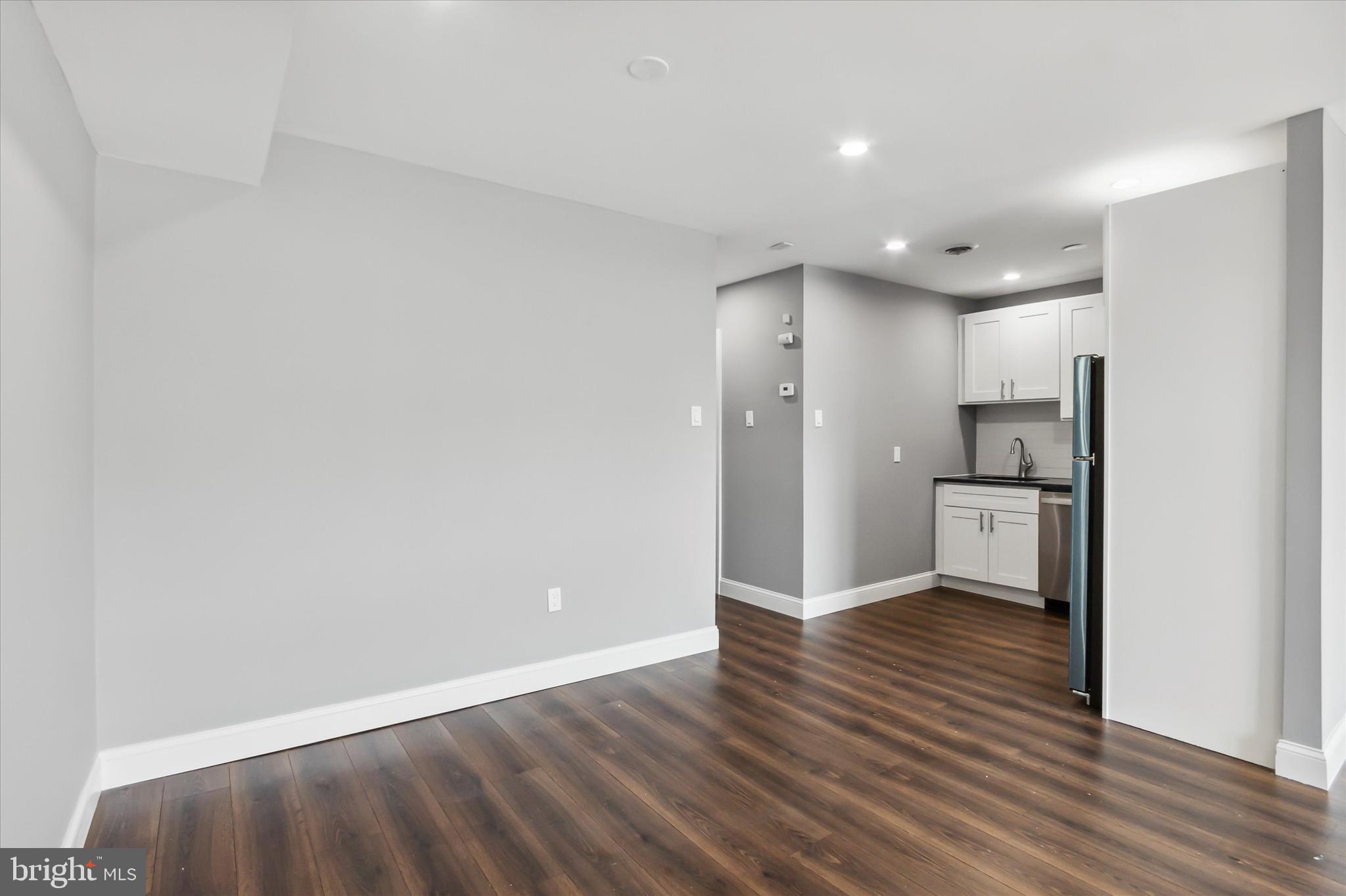 296 Greenough Street, Unit 2 Philadelphia, PA 19127 - Photo 7 of 24 a view of a kitchen with a refrigerator and a stove