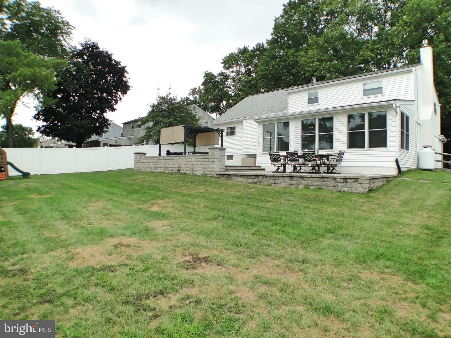 279 Norfolk Road Warminster, PA 18974 - Photo 40 of 41 Rear View of House, Patio and Fenced In Backyard