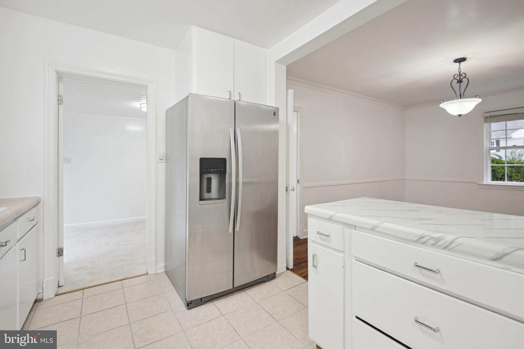 2926 Kanawha Street Northwest Washington, DC 20015 - Photo 14 of 34 a kitchen with a refrigerator and a sink