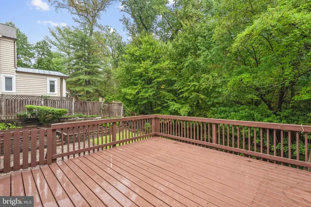 a view of deck with wooden floor and outdoor seating