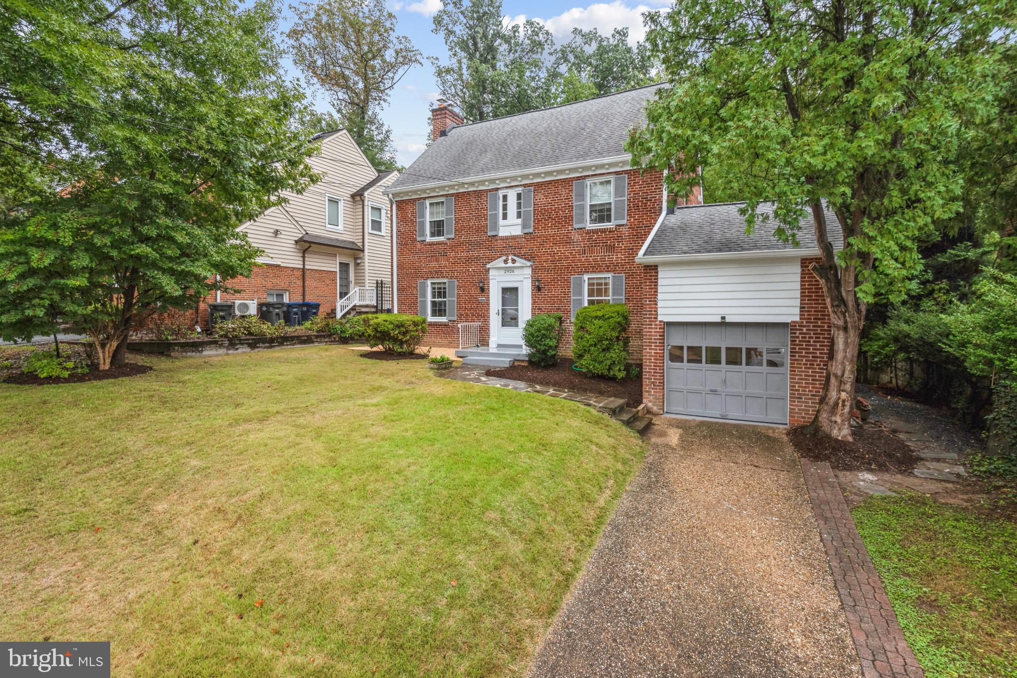 2926 Kanawha Street Northwest Washington, DC 20015 - Photo 2 of 34 front view of a house with a yard