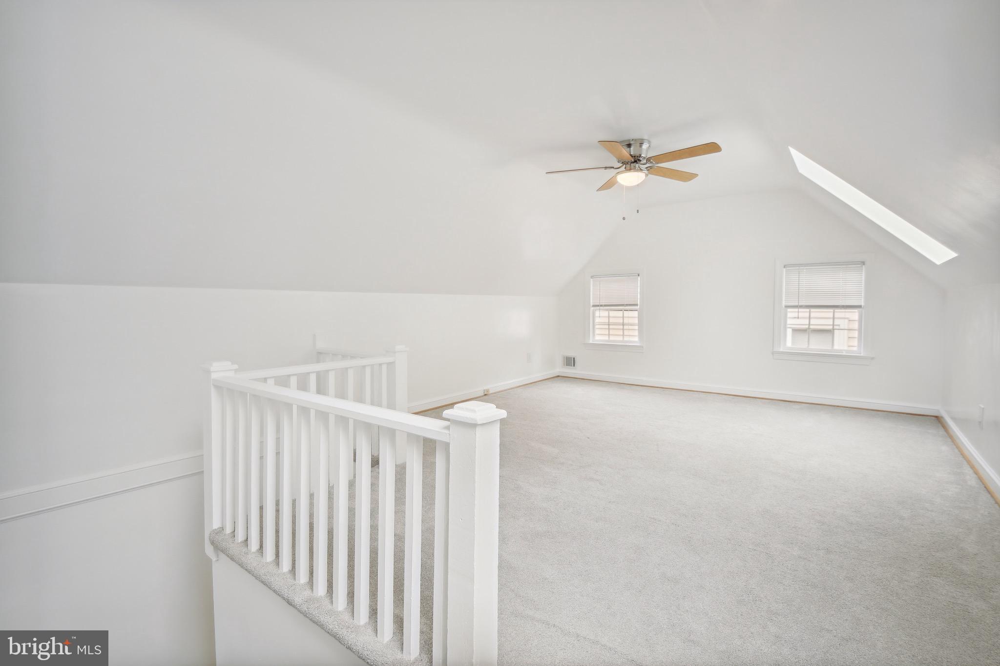 2926 Kanawha Street Northwest Washington, DC 20015 - Photo 26 of 34 an empty room with windows and fan