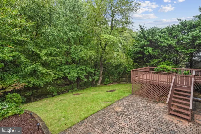 a view of a backyard with sitting area