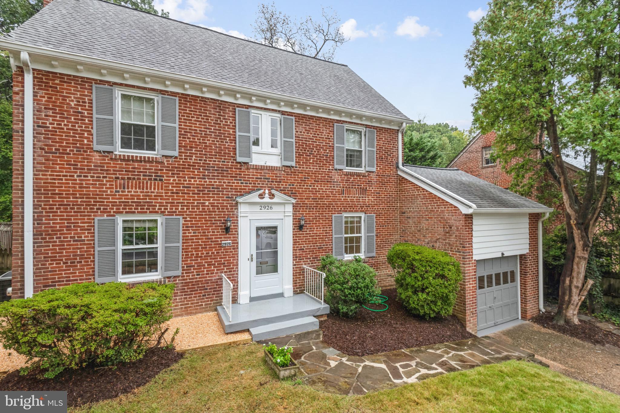 2926 Kanawha Street Northwest Washington, DC 20015 - Photo 3 of 34 a front view of a house with garden