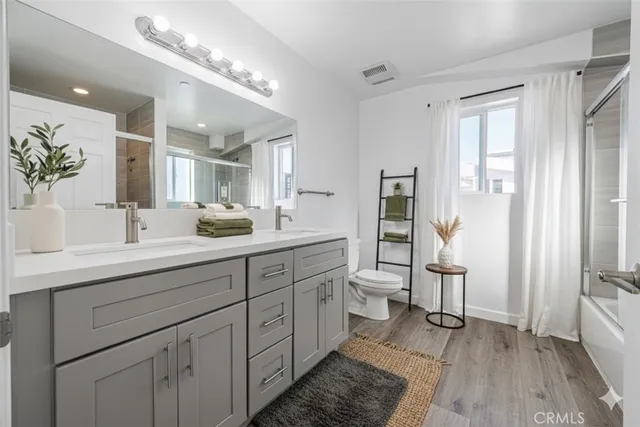 a view of a cars park in front of a building