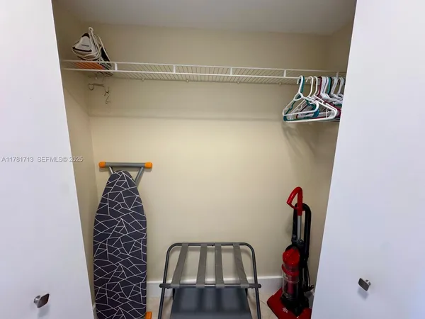 a view of water heater room with an empty room