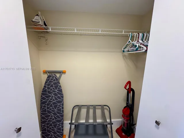 a view of water heater room with an empty room