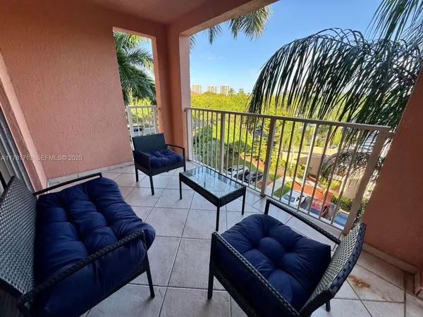 a view of a terrace with sitting area