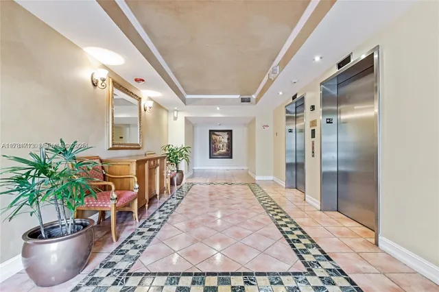 a front view of a residential apartment building with a yard