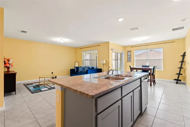a kitchen with a stove and a refrigerator