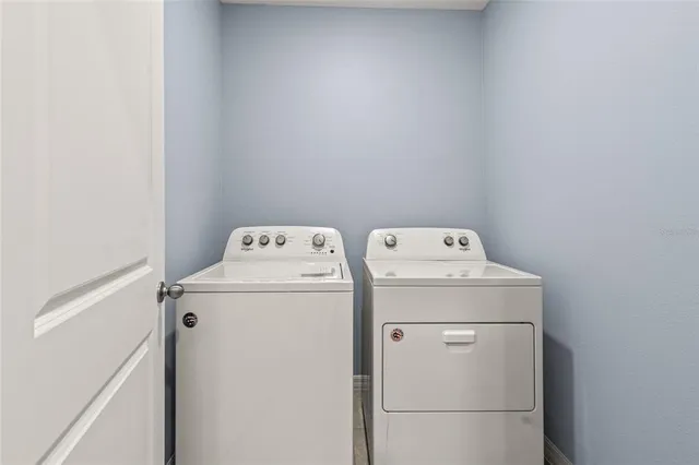 a utility room with dryer and washer