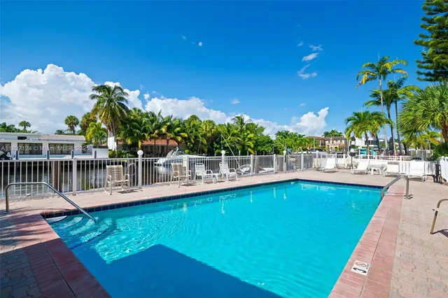 a view of a swimming pool with a lounge chairs
