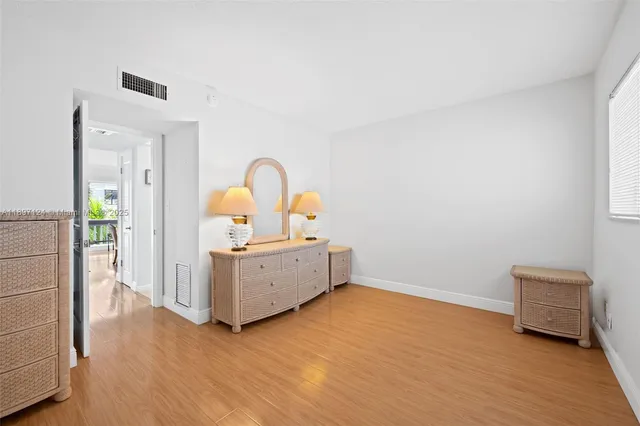 a room with furniture and wooden floor