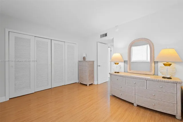 a view of a bathroom with sink and mirror