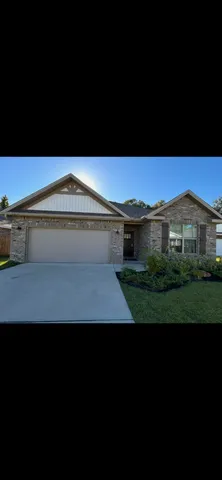a view of house with yard