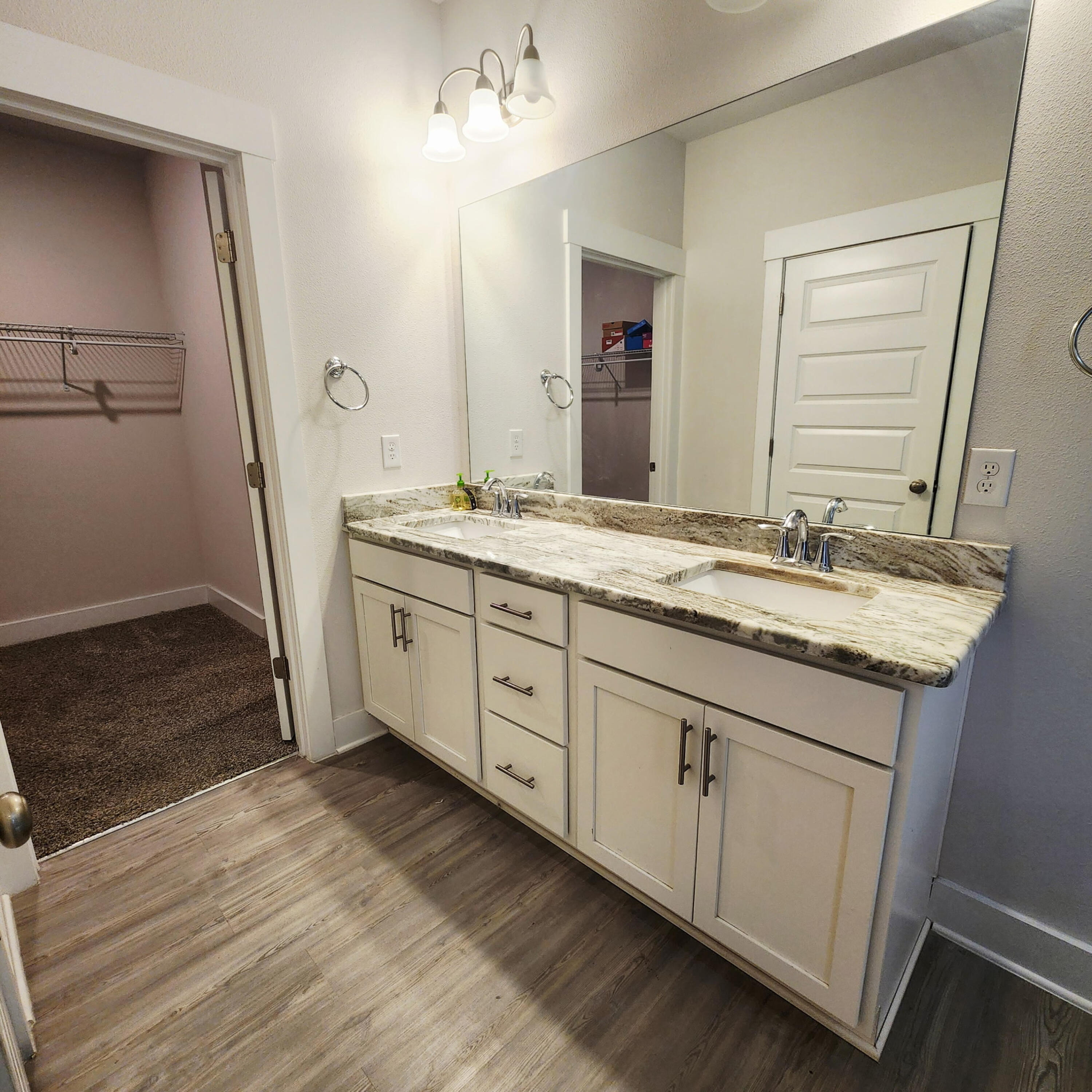 1927 Appleton Drive Cantonment, FL 32533 - Photo 5 of 8 a spacious bathroom with a granite countertop sink and a mirror