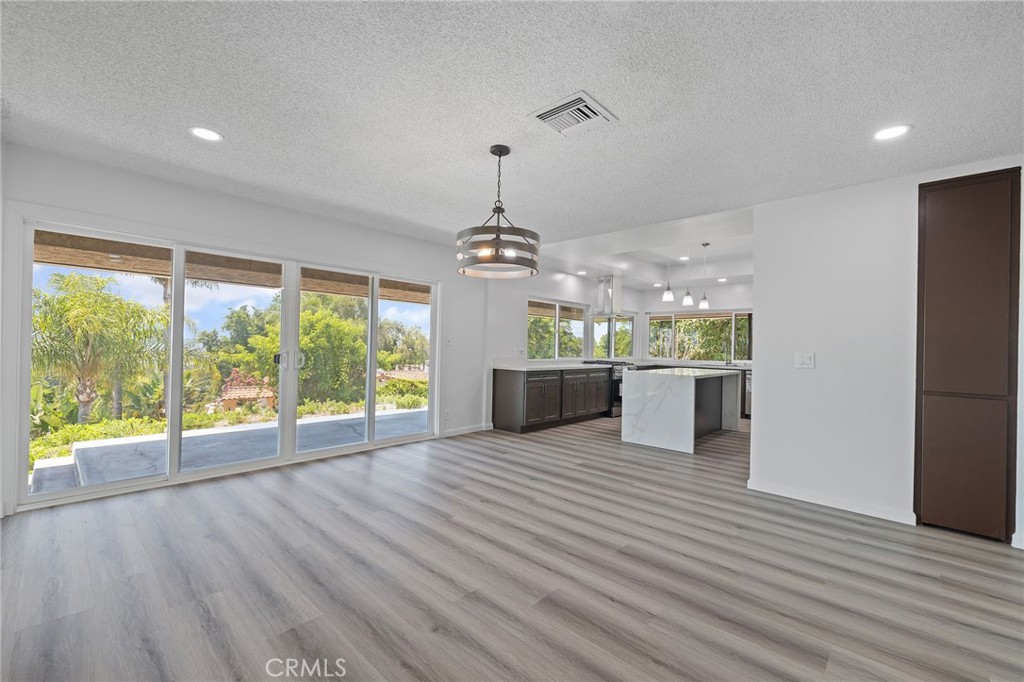 1281 Mayapan Road La Habra Heights, CA 90631 - Photo 14 of 65 a view of a room with kitchen wooden floor and windows