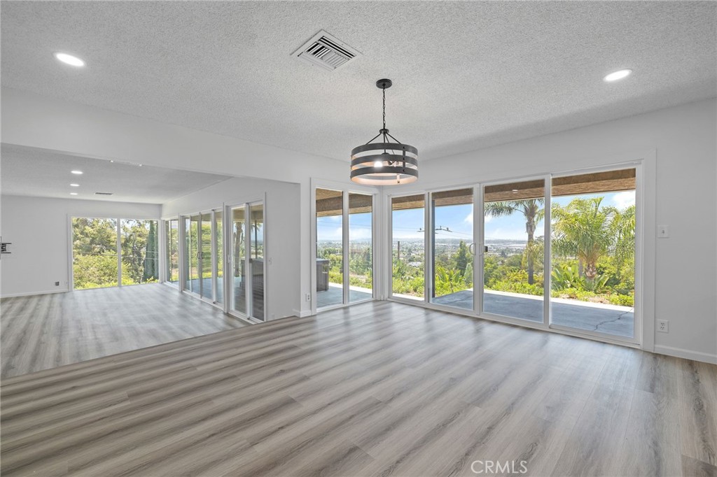 1281 Mayapan Road La Habra Heights, CA 90631 - Photo 15 of 65 a view of an empty room with wooden floor and a window