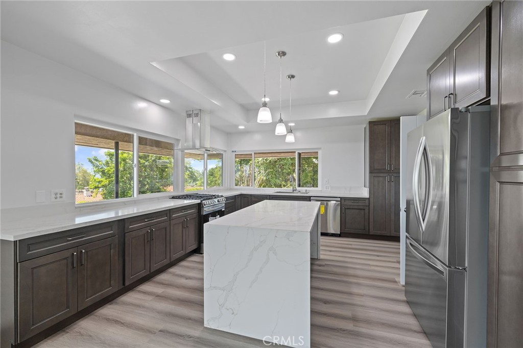 1281 Mayapan Road La Habra Heights, CA 90631 - Photo 20 of 65 a kitchen with stainless steel appliances granite countertop sink refrigerator and window