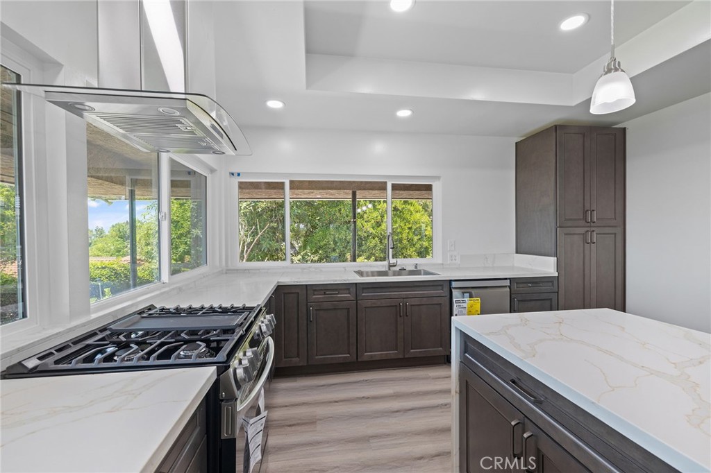 1281 Mayapan Road La Habra Heights, CA 90631 - Photo 21 of 65 a kitchen with a stove a sink and a refrigerator