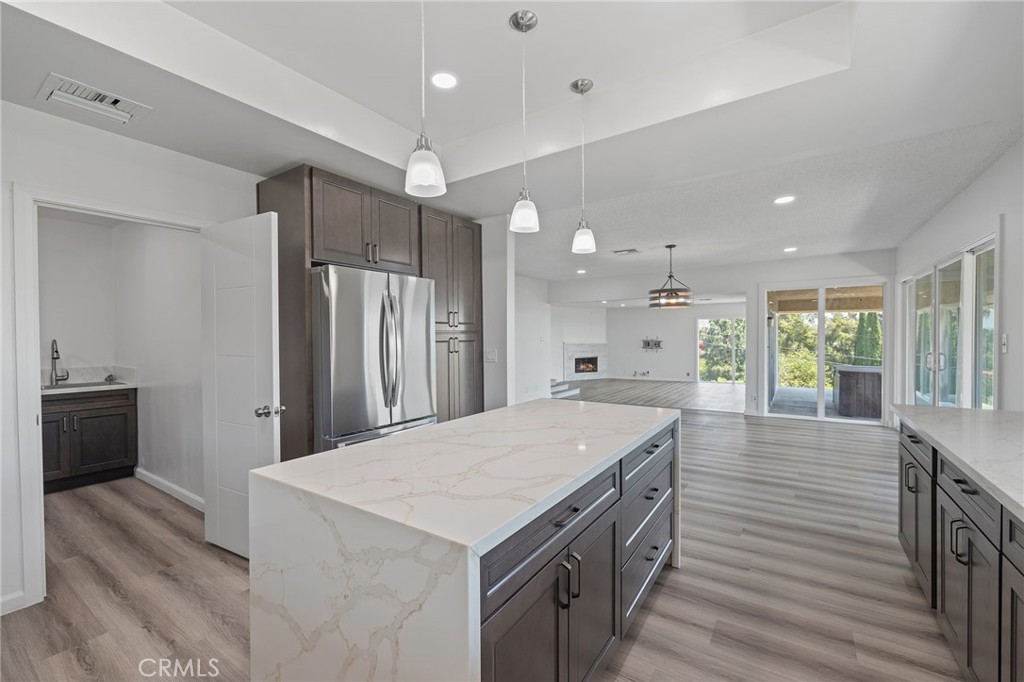 1281 Mayapan Road La Habra Heights, CA 90631 - Photo 22 of 65 a kitchen with a stove a refrigerator and a sink