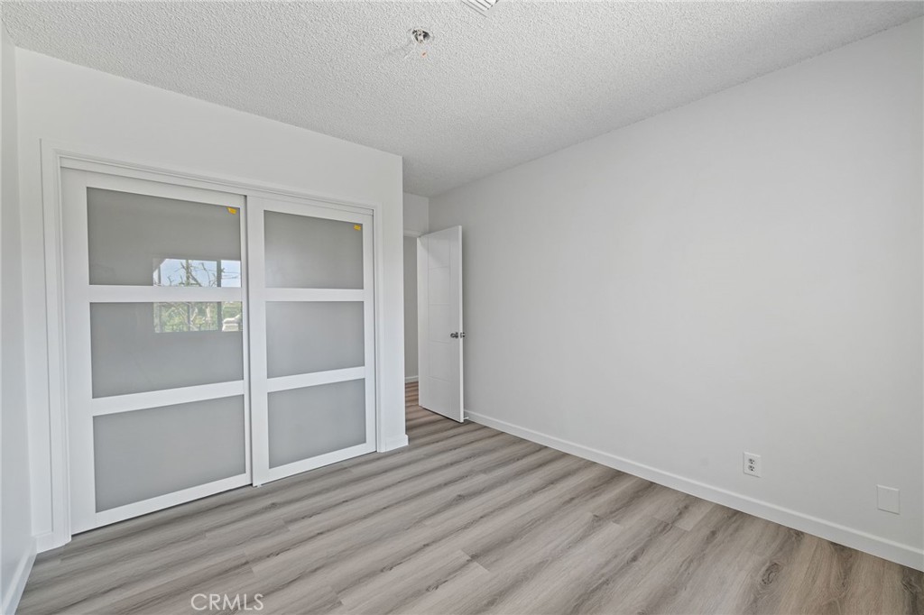 1281 Mayapan Road La Habra Heights, CA 90631 - Photo 28 of 65 a view of an empty room with wooden floor and closet