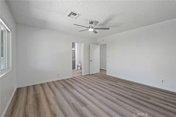 a bathroom with a shower and a toilet