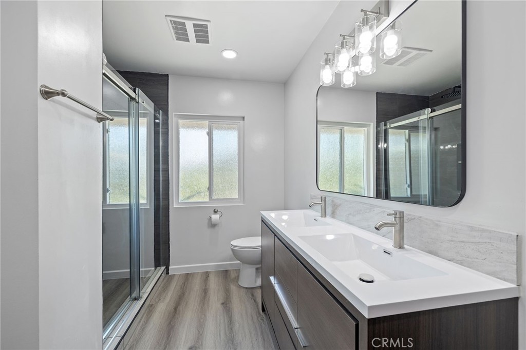 1281 Mayapan Road La Habra Heights, CA 90631 - Photo 39 of 65 a bathroom with a sink double vanity and a mirror