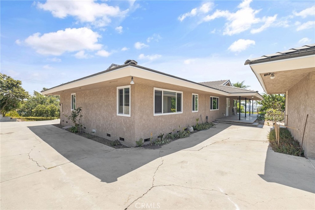 1281 Mayapan Road La Habra Heights, CA 90631 - Photo 51 of 65 a front view of a house with a garden