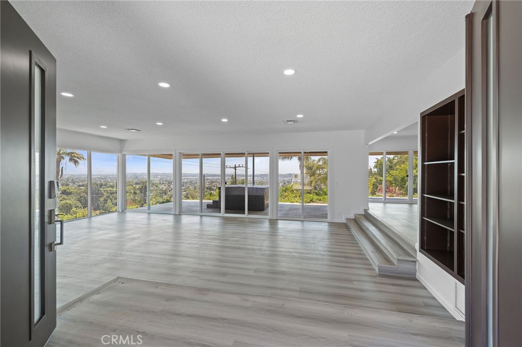 1281 Mayapan Road La Habra Heights, CA 90631 - Photo 7 of 65 an empty room with wooden floor and floor to ceiling window