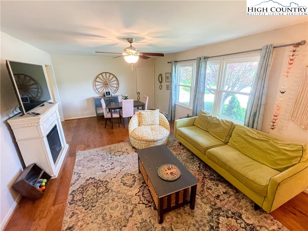 153 Wey Street Boone, NC 28607 - Photo 13 of 41 a living room with furniture a rug and a large window