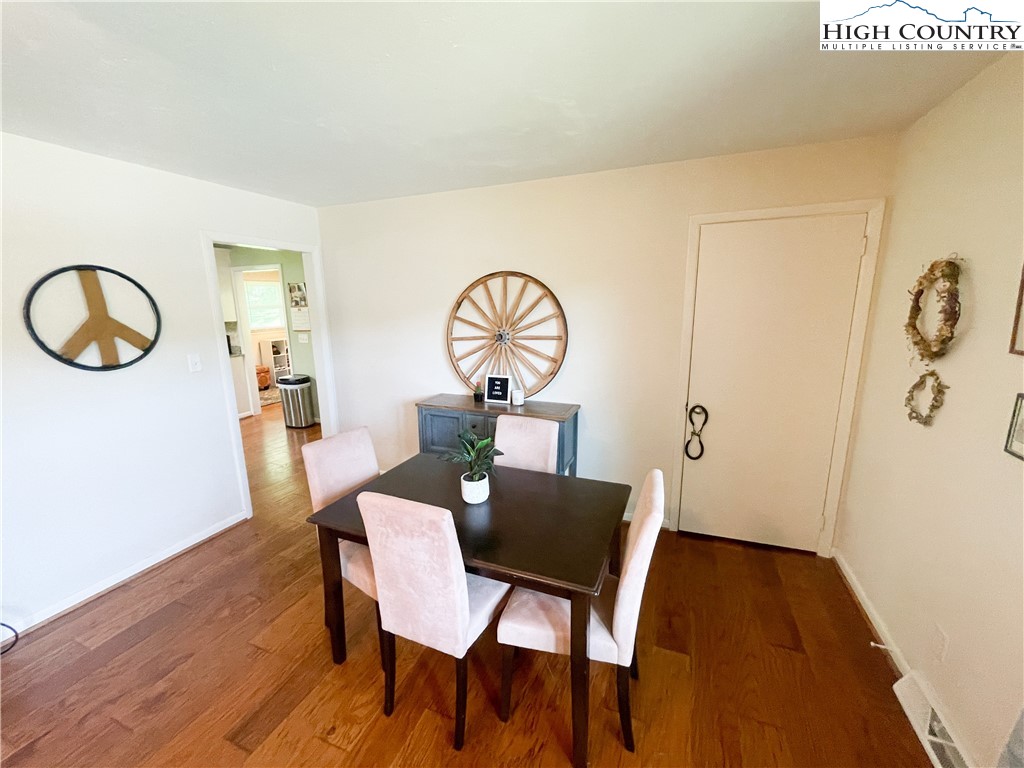 153 Wey Street Boone, NC 28607 - Photo 15 of 41 a view of a dining room with furniture and wooden floor