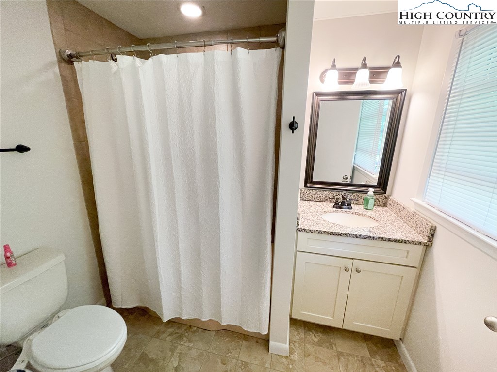 153 Wey Street Boone, NC 28607 - Photo 20 of 41 a bathroom with a granite countertop sink toilet and shower