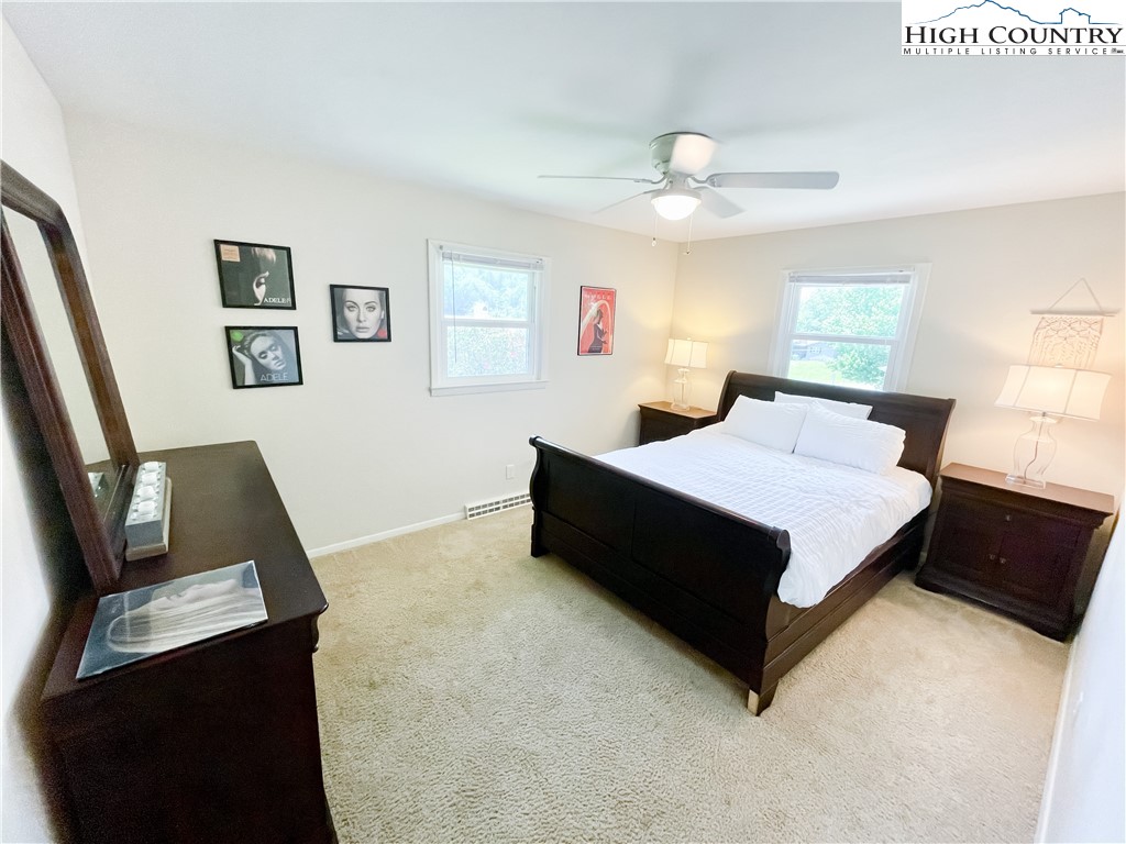 153 Wey Street Boone, NC 28607 - Photo 22 of 41 a bedroom with a bed window and a couch