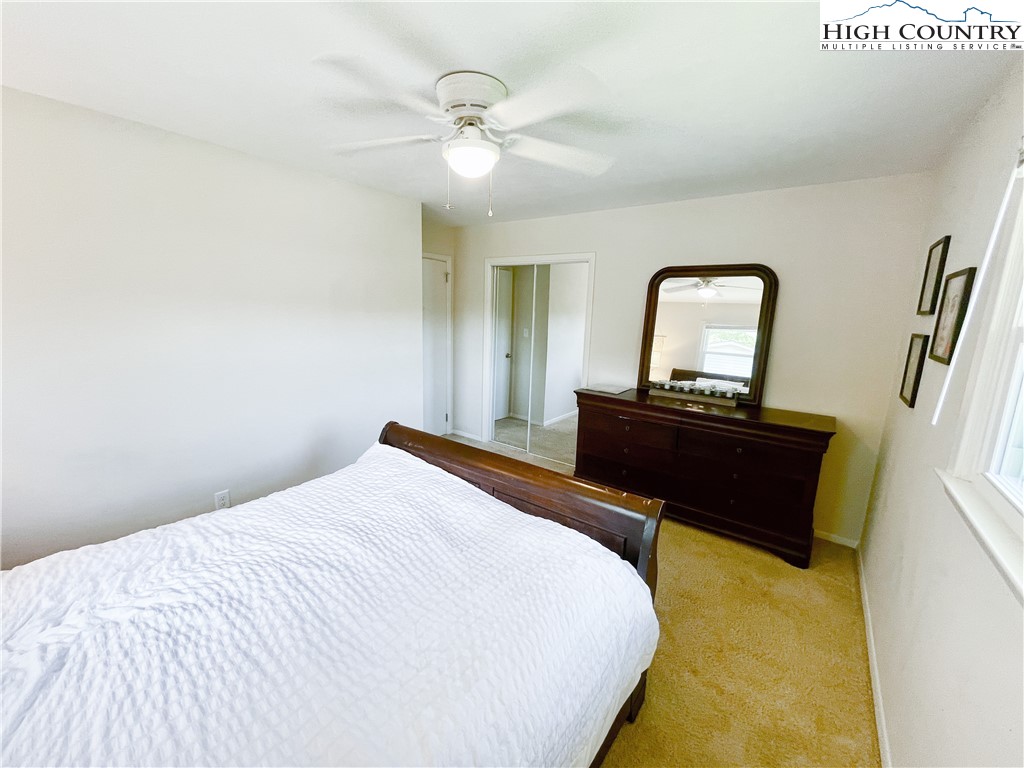 153 Wey Street Boone, NC 28607 - Photo 23 of 41 a bedroom with a bed and a dresser