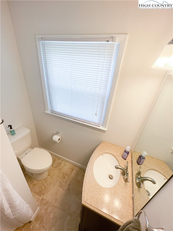 153 Wey Street Boone, NC 28607 - Photo 27 of 41 a bathroom with a sink mirror vanity and toilet