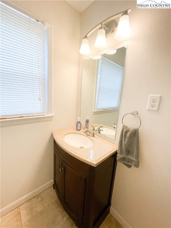 153 Wey Street Boone, NC 28607 - Photo 28 of 41 a bathroom with a sink and a mirror