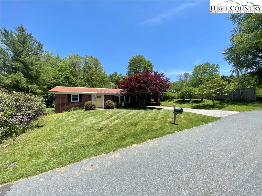 153 Wey Street Boone, NC 28607 - Photo 36 of 41 a view of a house with a yard