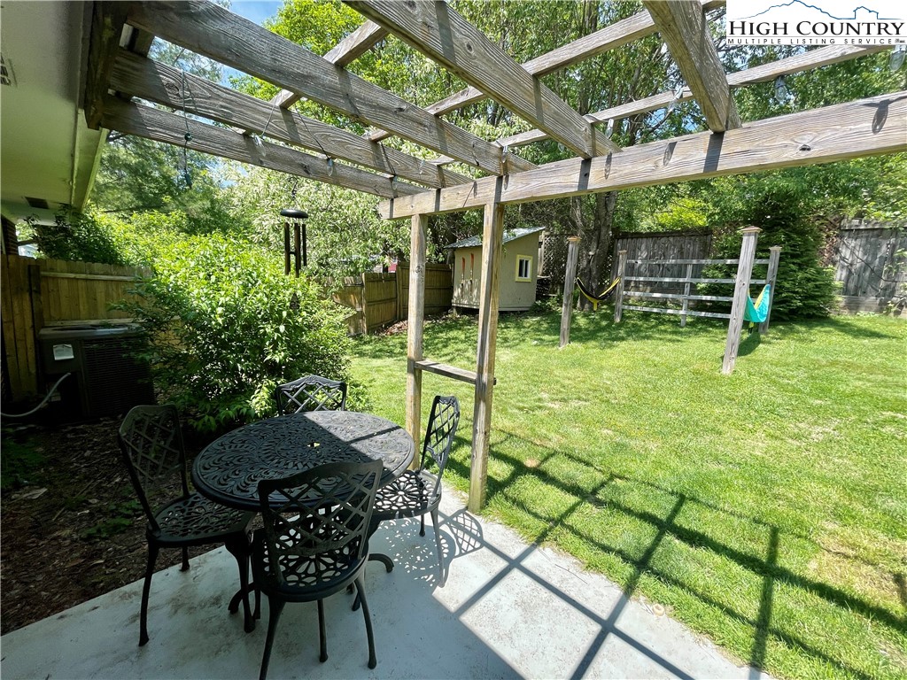 153 Wey Street Boone, NC 28607 - Photo 37 of 41 a backyard of a house with table and chairs